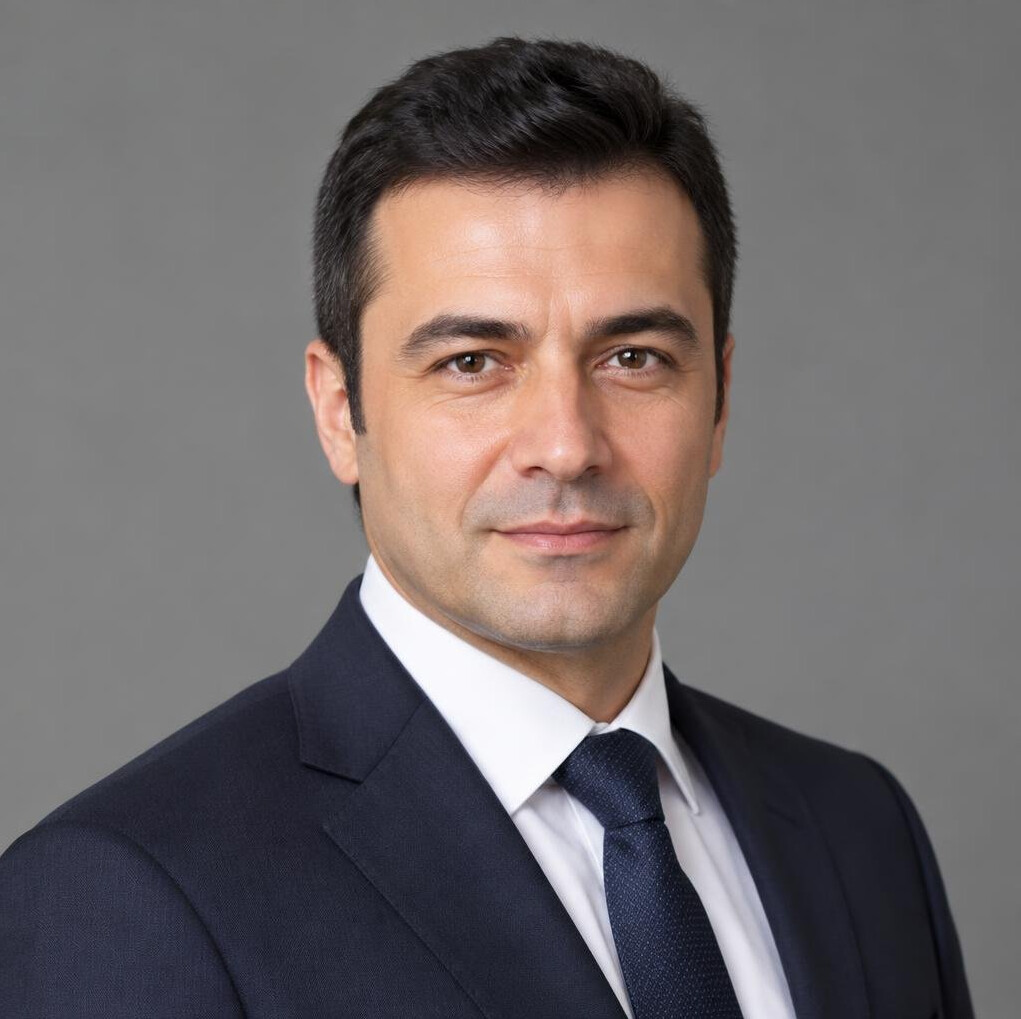 Portrait of a Turkish man in a suit smiling
